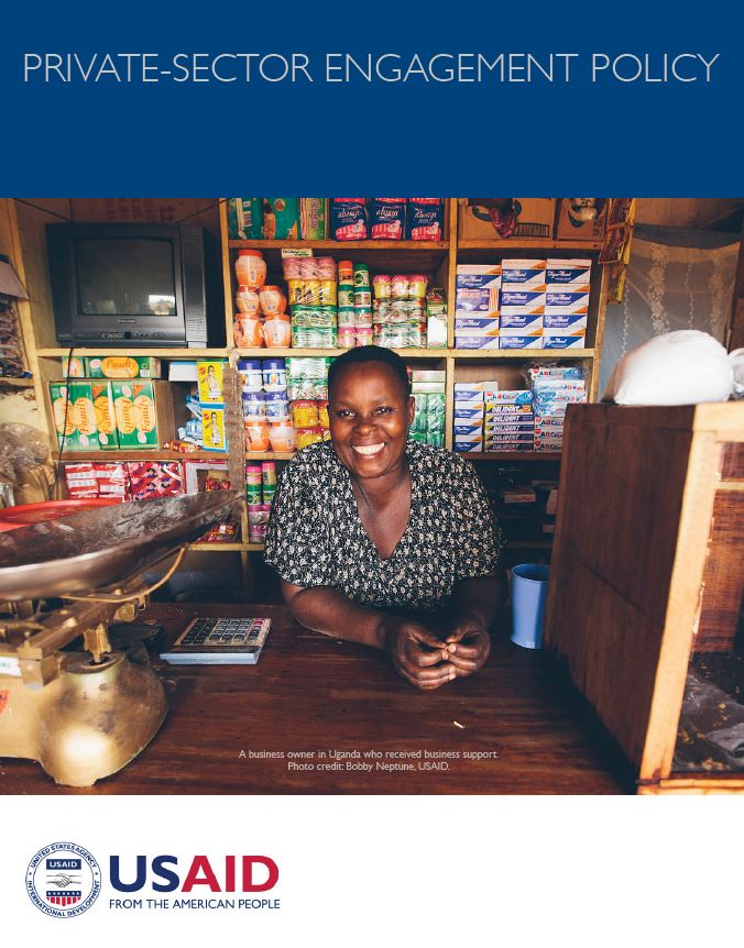 Document cover page featuring a photo of a woman behind the counter of a store