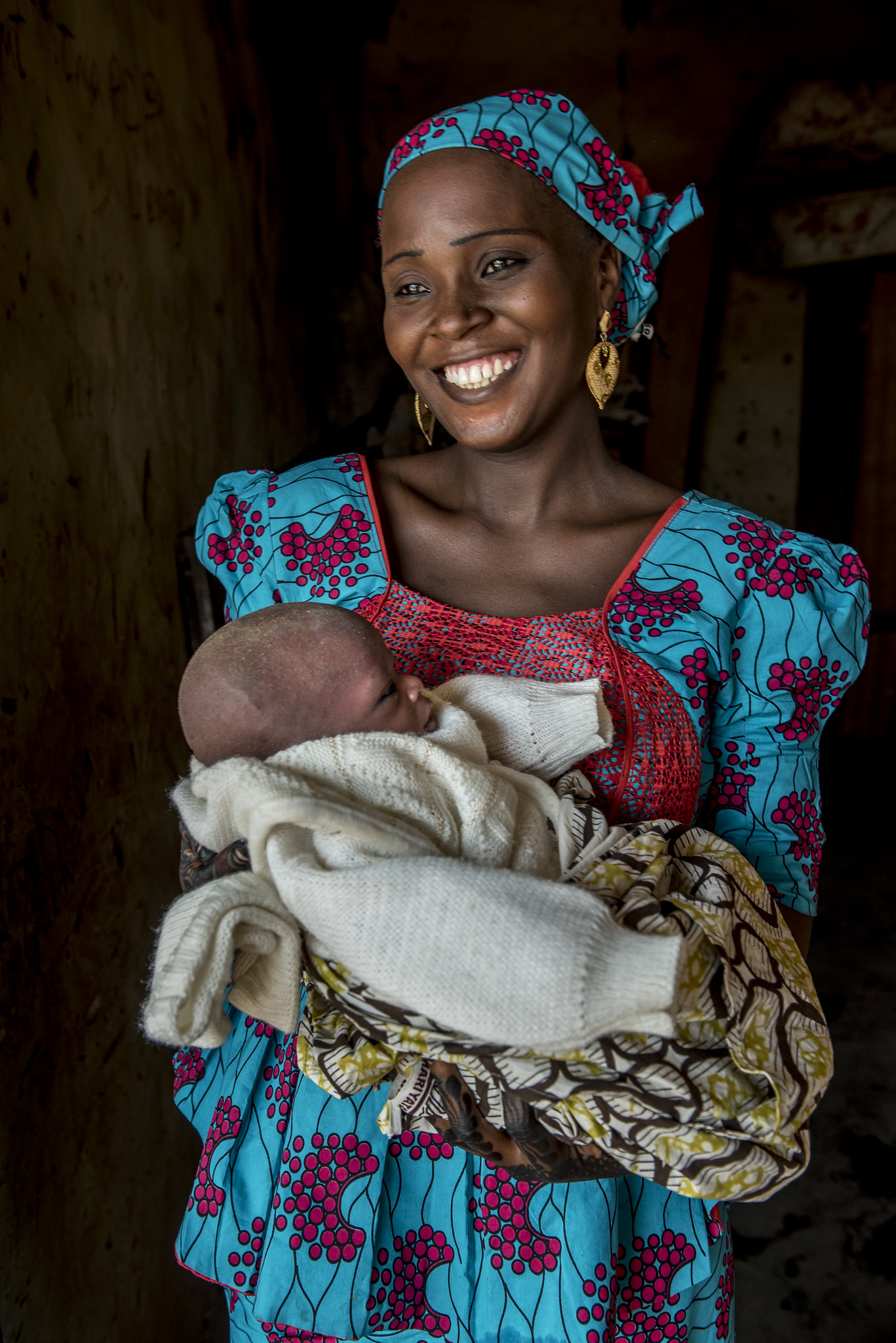 African woman holding an infant