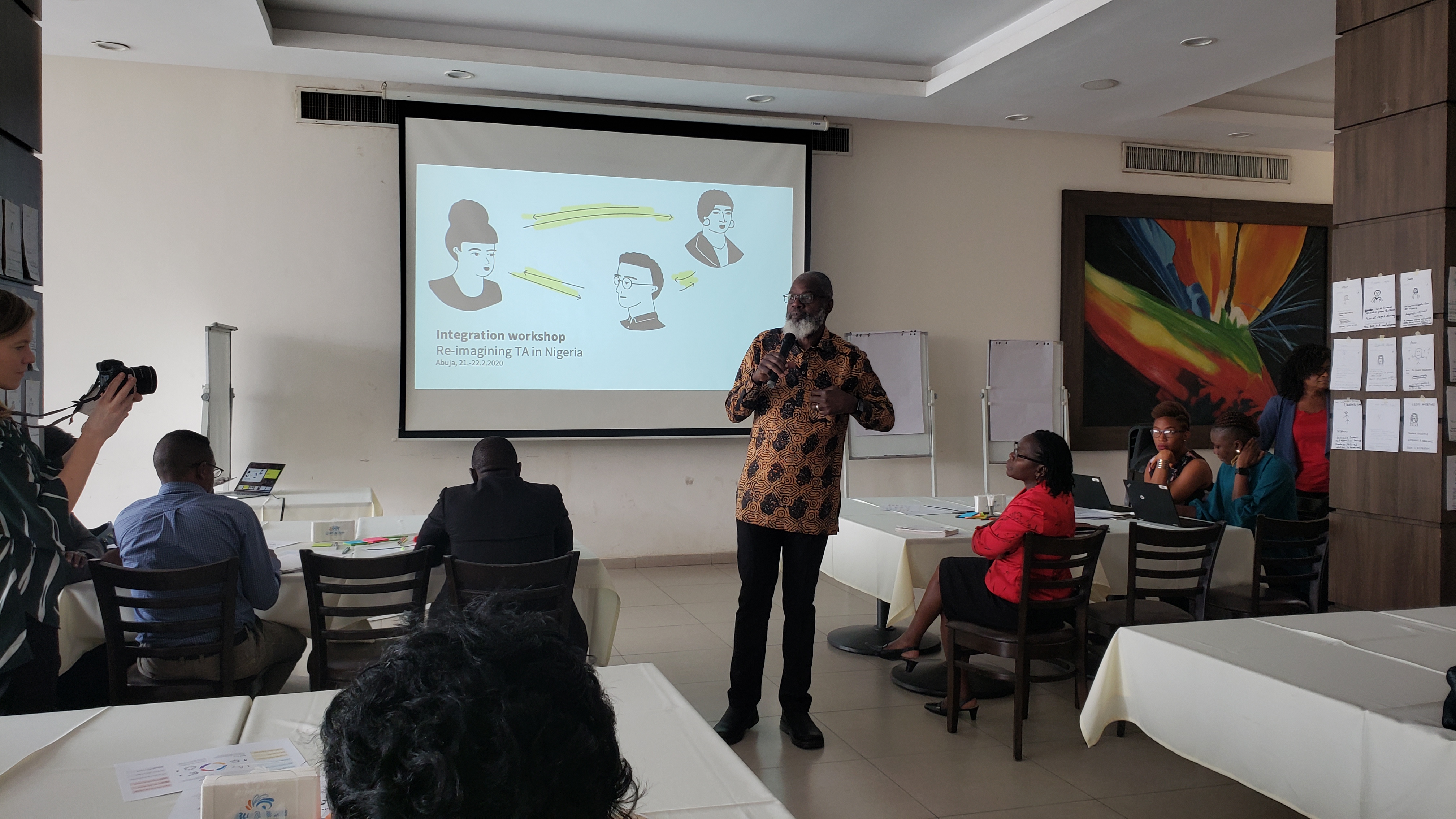 Participant at the Nigeria integration workshop presents findings in front of group.