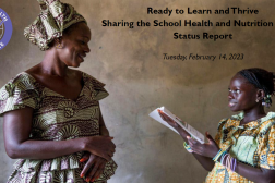 A mother in Senegal joyfully listens to her child read