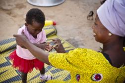 Woman playing with her child in Ghana