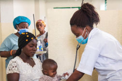 Health care worker monitoring child